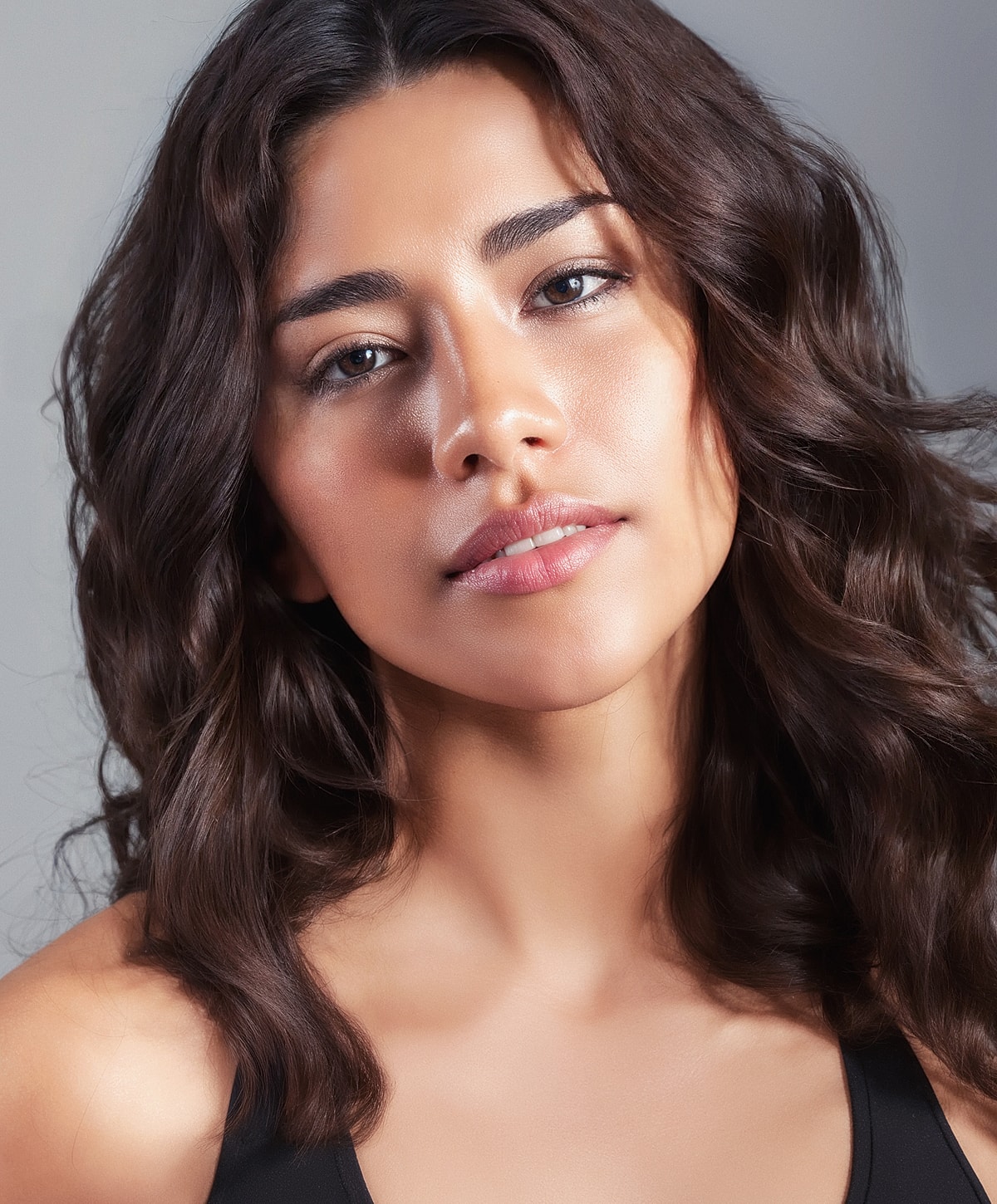 Portrait of a woman with wavy hair.