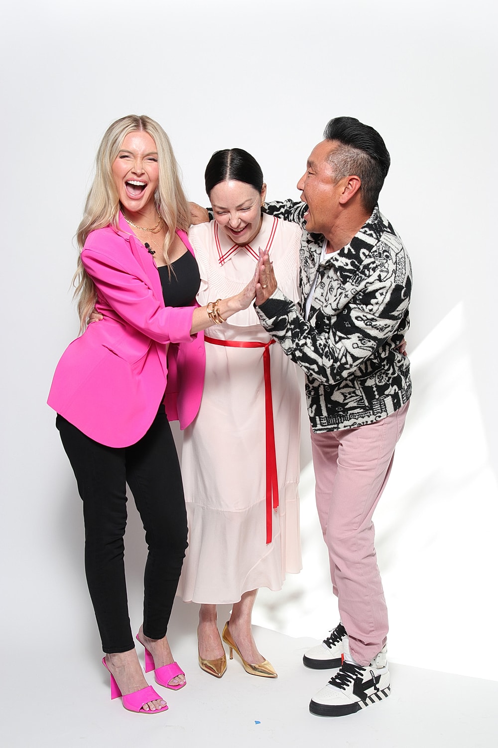 Three friends enjoying a playful moment together.