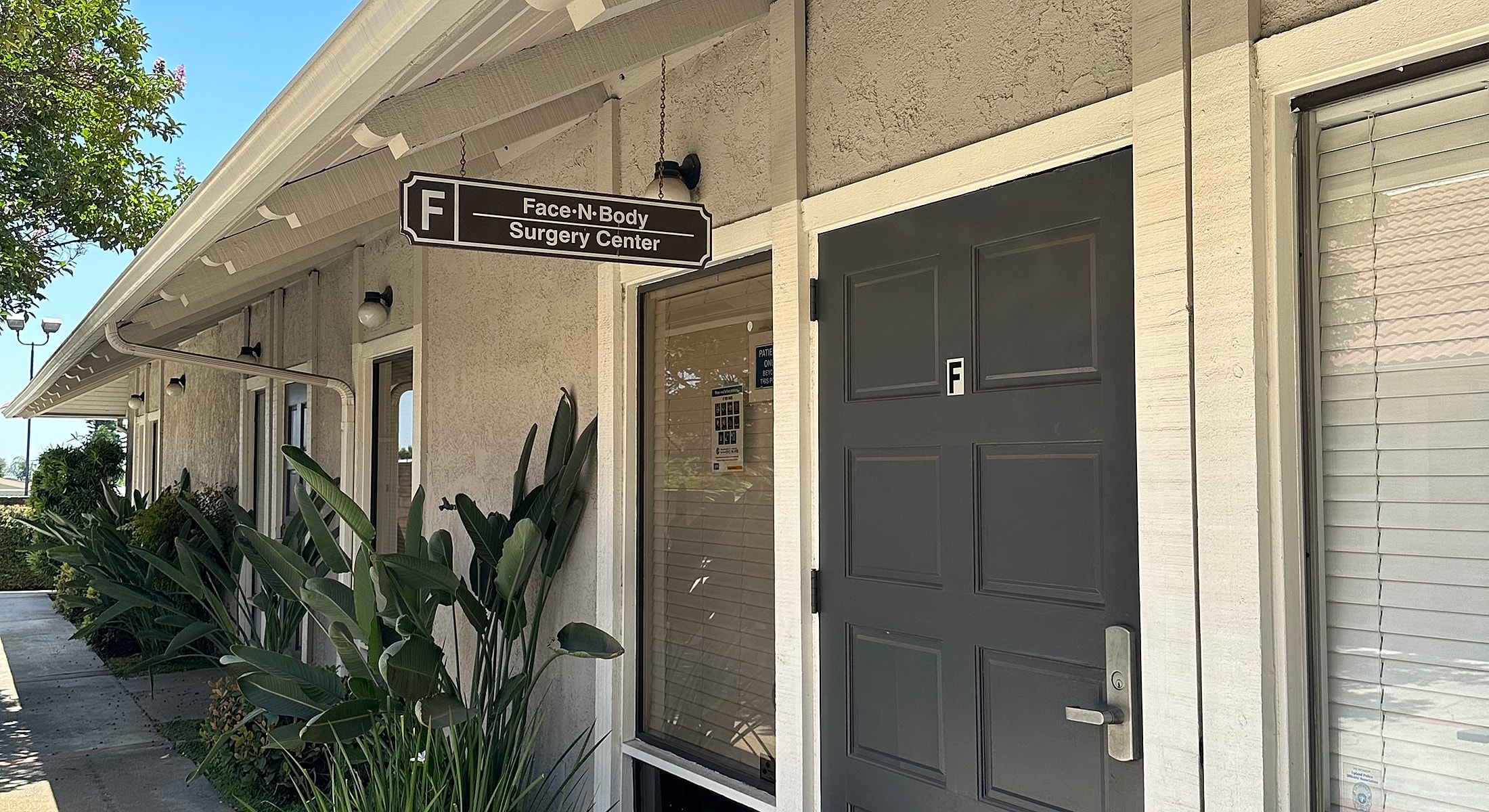 Surgical table with colorful cushions in dim lighting.